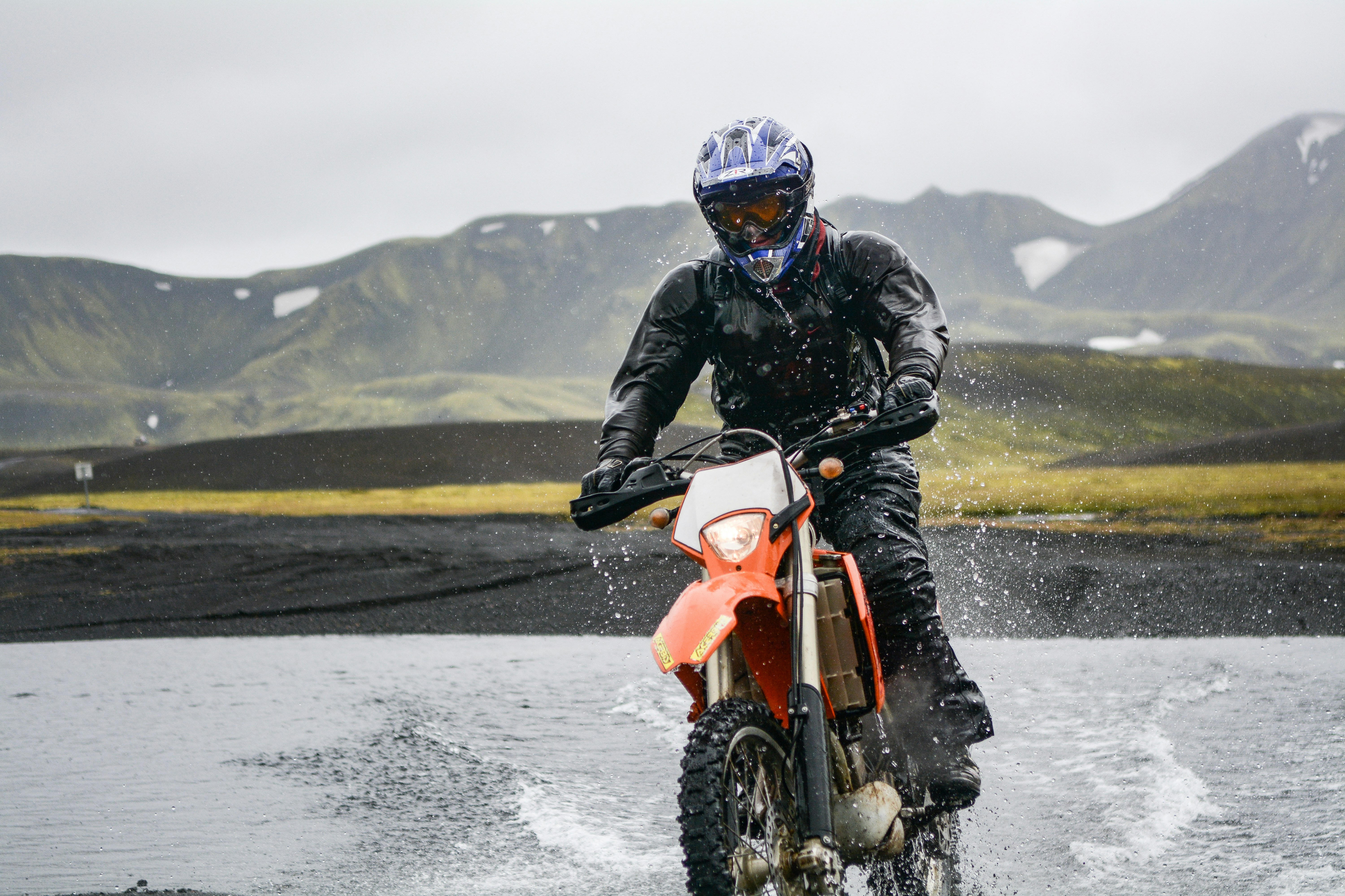 Motorcyclist crossing a shallow river on an Icelandic F-road