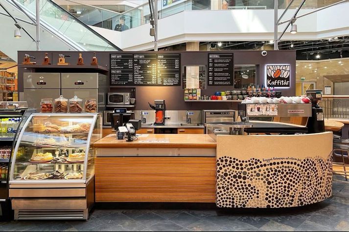 A café counter in Iceland with pastries and coffee service