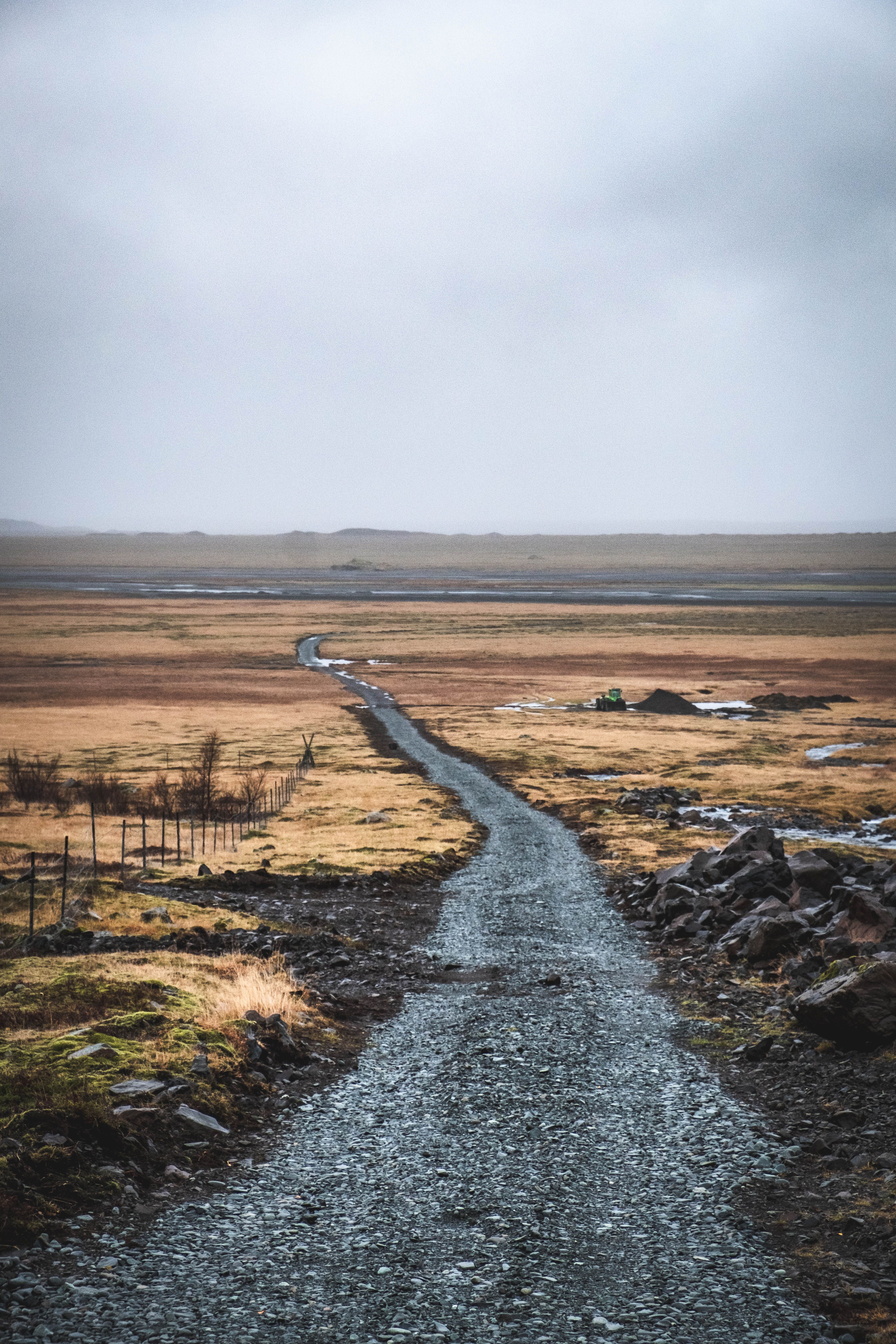 Long gravel F-road stretching through the empty Icelandic highlands