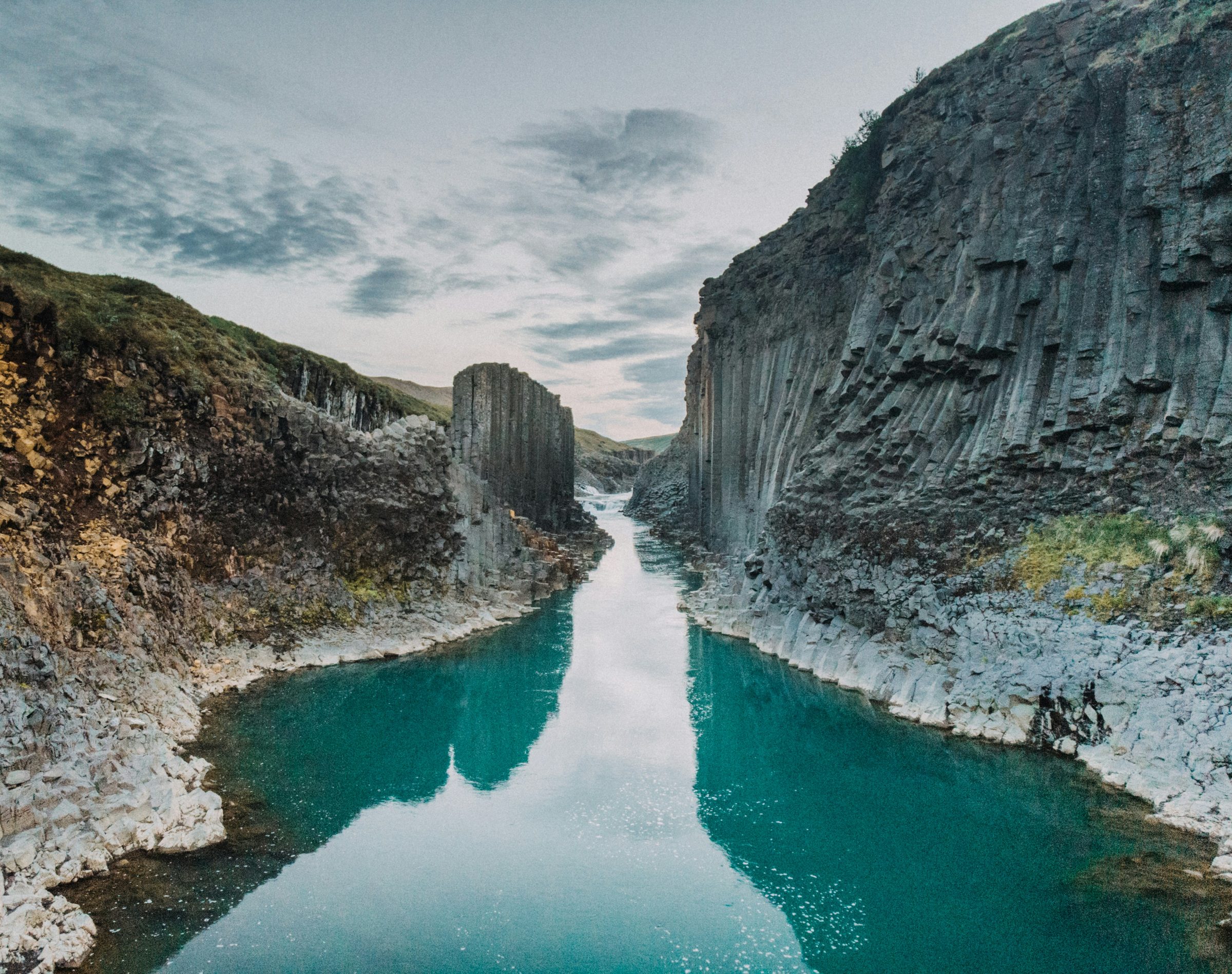 Stuðlagil canyon with basalt columns and turquoise river water