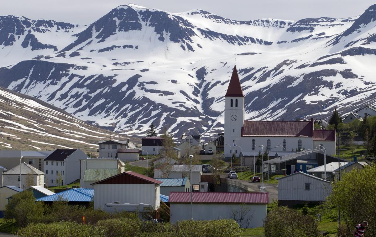 Siglufjörður town with painted houses tucked under steep mountains