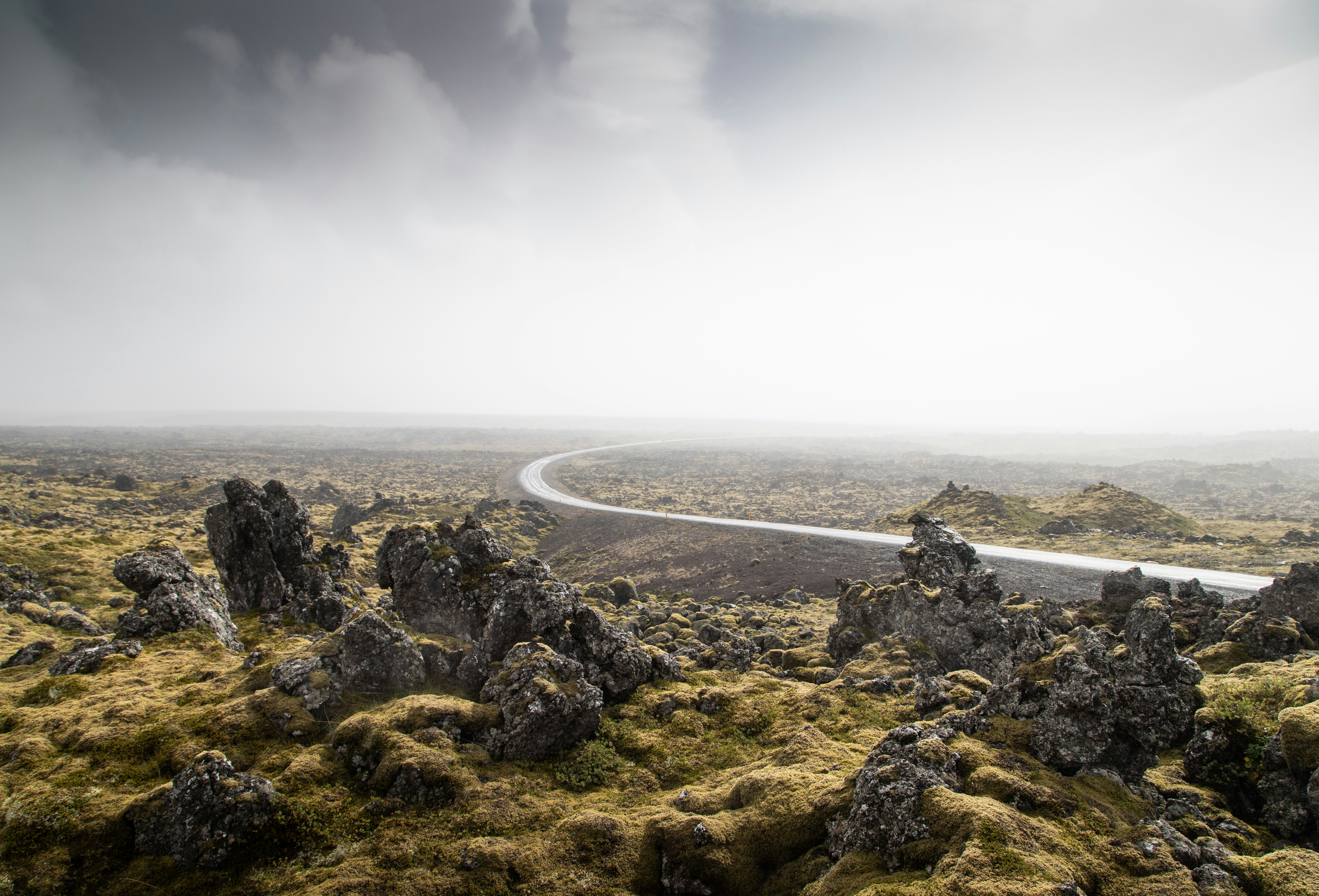 Foggy road through Icelandic lava field