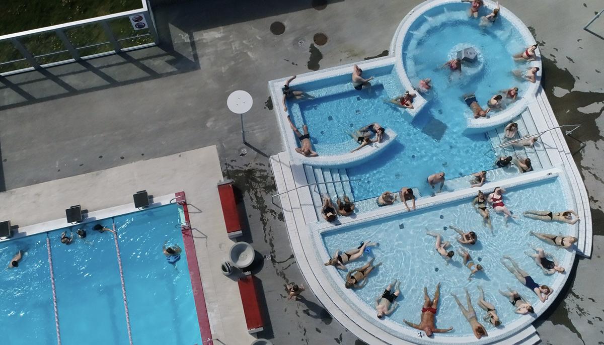 Vesturbæjarlaug public swimming pool in Reykjavík with steam rising