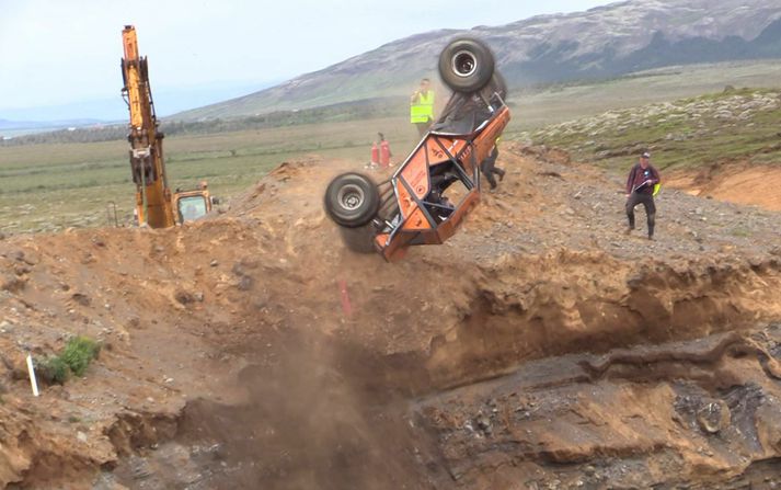 Modified torfæra buggy attempting a near-vertical climb